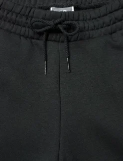Kvinnor New Balance Mjukisbyxor|Linear Heritage Fleece Wide Leg Pant - Sweatpants