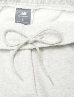 Kvinnor New Balance Mjukisbyxor|Sport Essentials Fleece Jogger - Sweatpants